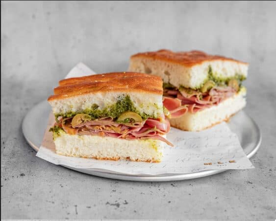 MLK Deli MLK sandwich with mortadella, stracciatella and pistachios on focaccia