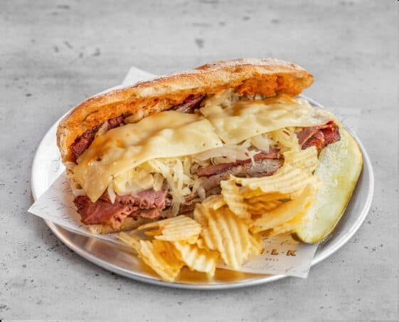 MLK Deli Risky Brisket sandwich with smoked brisket pastrami and Swiss cheese